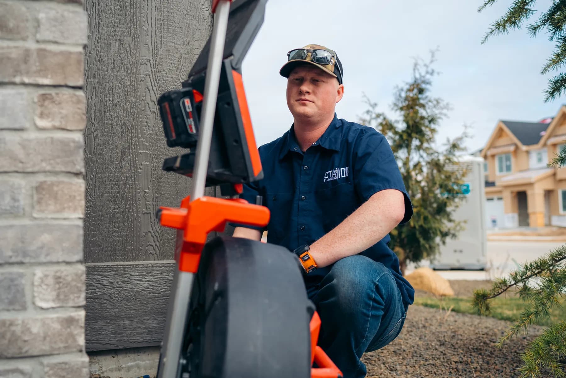 CTA Plumbing 100 technician carrying professional equipment at a Treasure Valley home